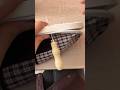 repairing a patterned fabric shoe by sewing the white rubber sole using a manual metal awl tool