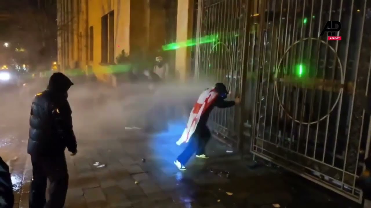 Police clash with protesters in streets near Tbilisi parliament CD