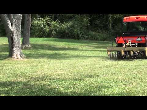 UTV Hitchworks - The Farmboy operating an aerator on the Kubota RTV 1100