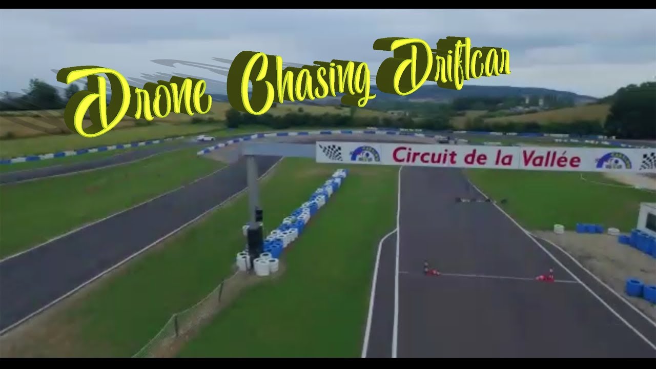 drone chasing a drifting  toyota jzx90 on a france go kart track