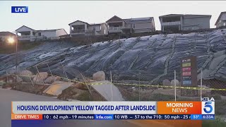 Housing development yellow tagged after landslide