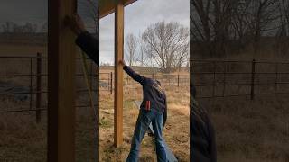 Installing Metal Post Wrap to protect a post. #postframe #diy #construction #diymetal #barn