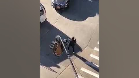 Only in New York- Man climbed onto Traffic lights