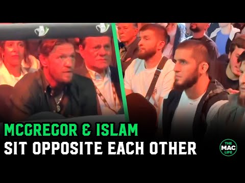 Conor McGregor and Islam Makhachev sit opposite each other at boxing event