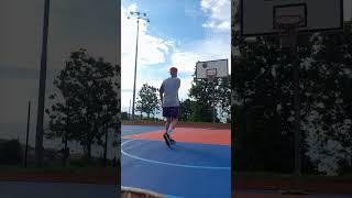 Skilled Guy Lands a Basketball Rebound Trickshot