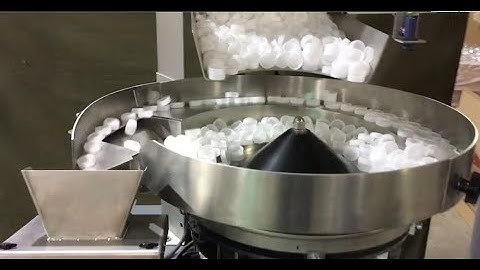 Batching Plastic Bottle Caps with BATCHMASTER® IV COUNTER from BATCHING SYSTEMS, INC