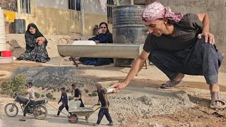 Nomadic life, working with cement in the courtyard, and handing the tools to his son.