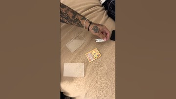 He Cracked a Base Set Charizard Pokemon Card