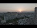 D-Log M. Mersin, Turkey. Sunset panorama over residential district with apartment buildings. Sun ...