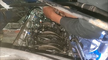 inside a cummins m11 engine installing exhaust,intake and injector push rods and push tubes.