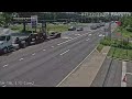 Truck snags power line and uproots utility pole
