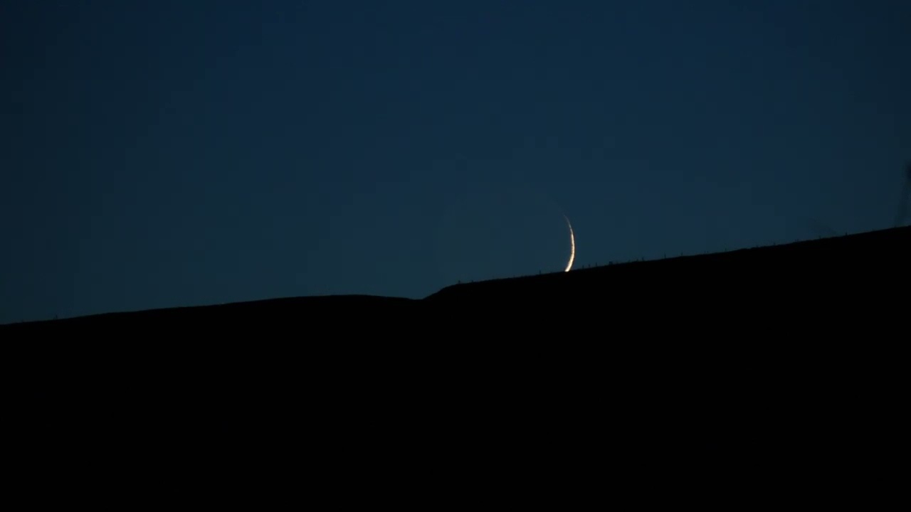 The Setting of the Thin Crescent Moon, 1.4 days old, over Scawt Hill, County Antrim