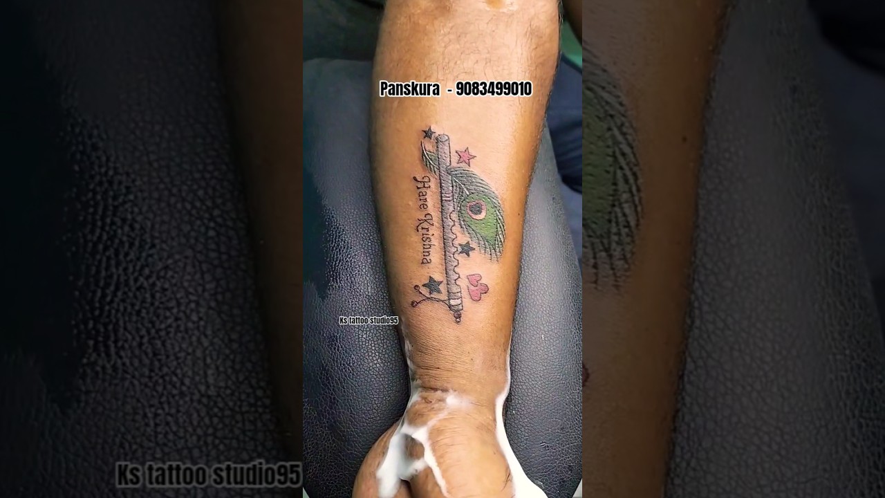 flute and feather tattoo 