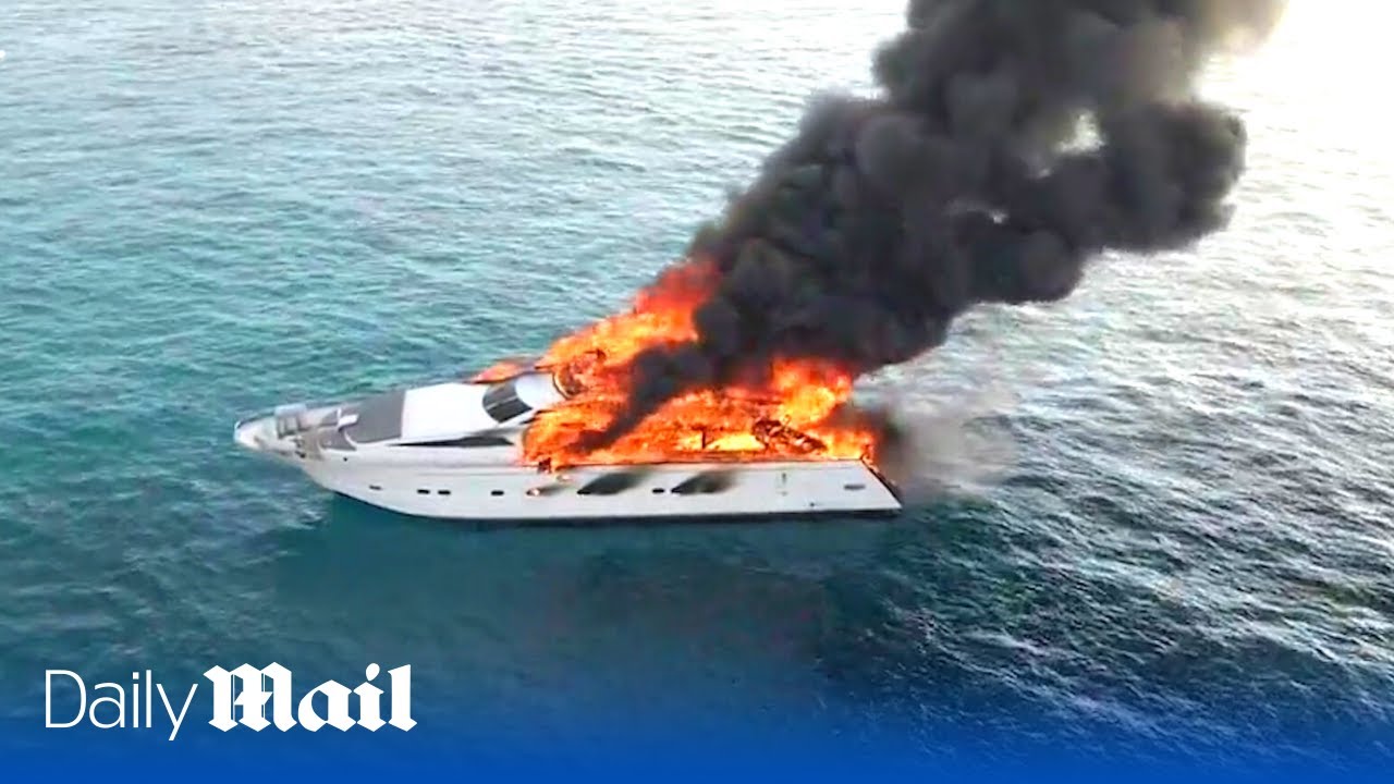 Drone footage of an 88ft luxury yacht blazing before sinking in Mediterranean sea