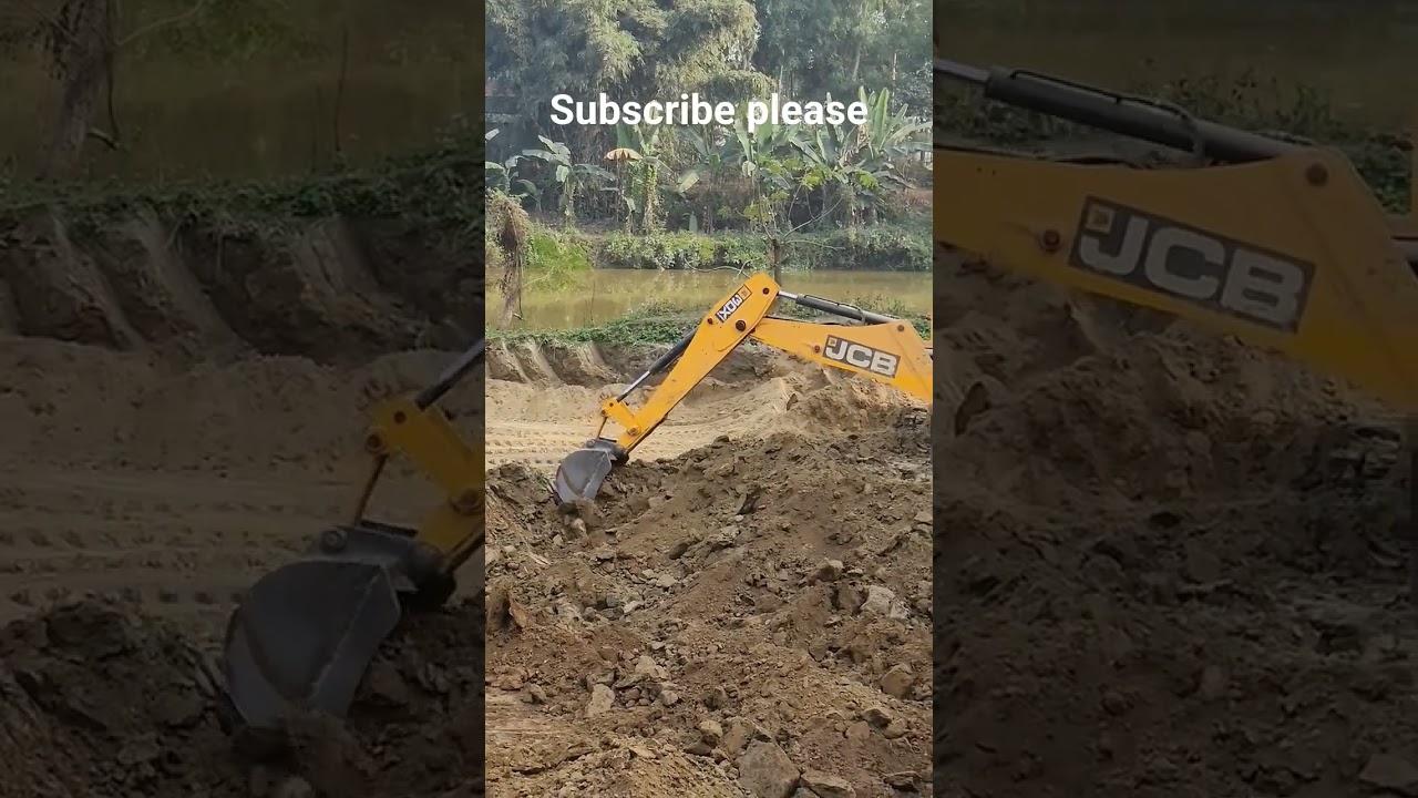 JCB loading soil in dump truck. 
