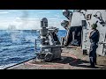 Us navys arleigh burkeclass guidedmissile destroyer engages with its powerful armament
