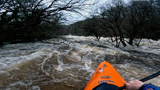 Kayaking down a huge flooded River Dart!