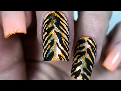 Wideo: Manicure z Tygrysem na Nowy Rok 2022