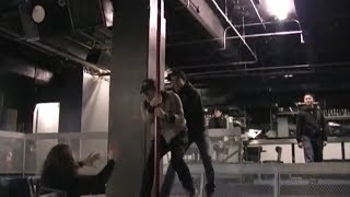 Pete Wentz and Patrick Stump working the pole