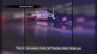 Semi-truck hangs over overpass at Crittenden Drive in Louisville