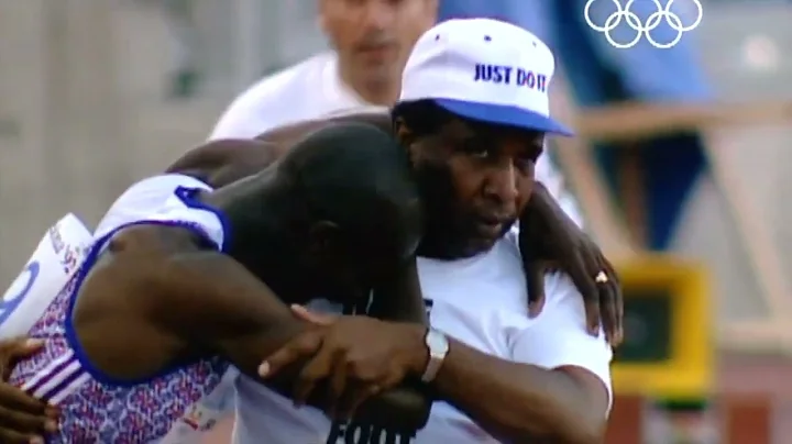 Derek Redmond's father helps him across the finish line at the 1992 Olympics