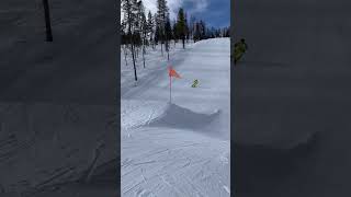Skier attempts backflip from ramps then falls forward and faceplants