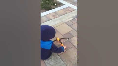 Three-year-old uses Nerf crossbow