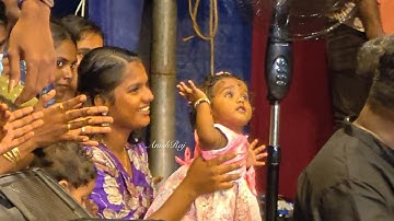 Nine-month-old Adrathi dancing with joy to the tune of a song at the Nagaraja Temple in Vettikode 