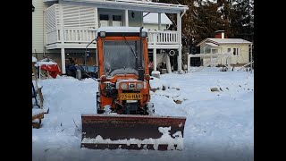 Kubota B7100 mini tractor snow plowing