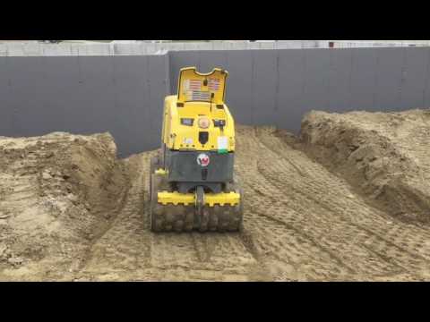 Wacker walk behind trench roller doing its thing