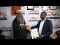Nyota Njema CEO Perminus Kariuki Handing Over Title Deed To Murtaza Najmi Nyota Njema CEO Perminus Kariuki Handing Over Title Deed To Murtaza Najmi