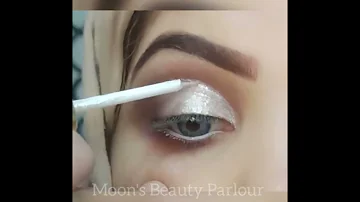 Silver glittery cut crease eye makeup for white dress