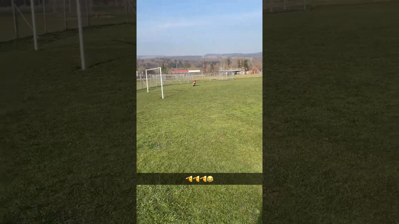 Boy in full face helmet jumps ramp then falls forward over handlebar