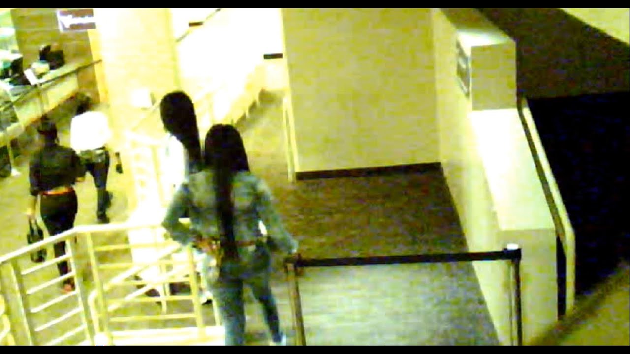 KENNEKA JENKINS ENTERING THE EAST BAR ENTRANCE ALSO THE CLEANING LADY
