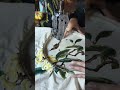 Using old-fashioned sewing machine to embroider a picture of birds and a pipa