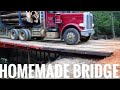 Peterbilt log truck on a homemade bridge