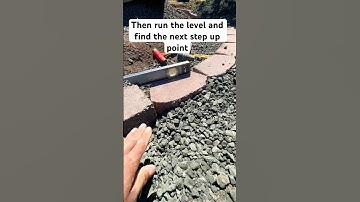 DIY Step Up Your Retaining Wall On a Slope 🪨 #diy #retainingwall #landscaping