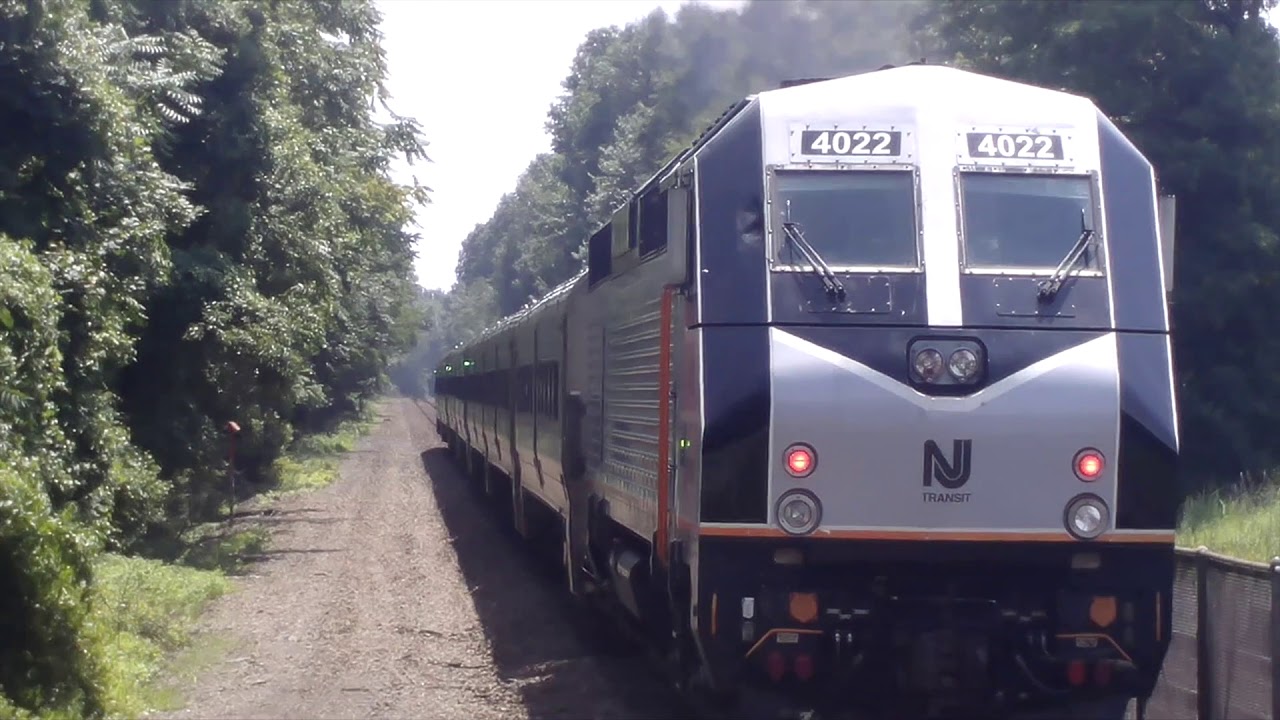 NJT Trains in Ramsey, NJ Featuring NS Freight Train Long Hood Forward