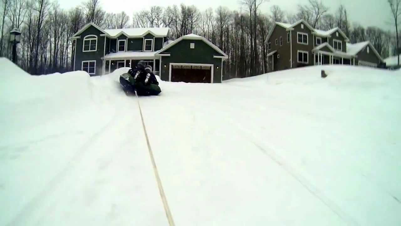 Snow tube behind a snowmobile YouTube