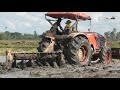 Tractor disc plough kubota m6040su ploughing at mud field | ត្រាក់ទ័រភ្ជួរដីស្រែ