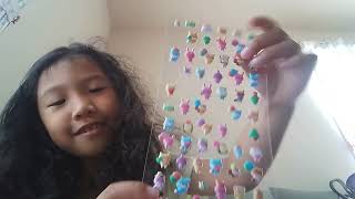 Shanaiah loves to collect stickers of different cartoon characters.