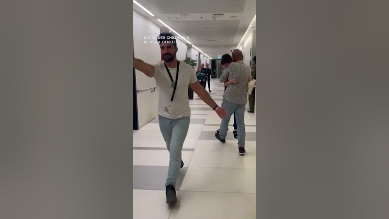 9-year-old former Israeli hostage run to reunite with his father