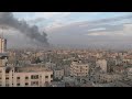 Smoke billows over Gaza City as 23rd day of war ends | AFP