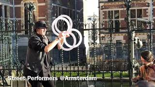 Street performers in Amsterdam man with glass balls