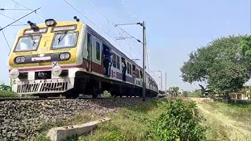 Katwa-Howrah Local With ICF Medha EMU thoroughly passing the railgate..