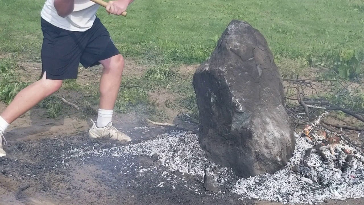 Busting rocks with fire - YouTube