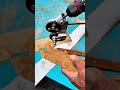 cutting a rusty metal sheet using a portable electric drill with a metal cutter attachment closely