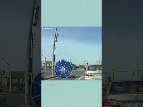 Giant spool of cable rolls through Ontario intersection #shorts