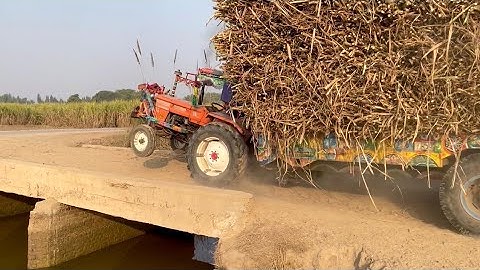 Fiat 480 crossing canal bridge with heavy loaded trolley
