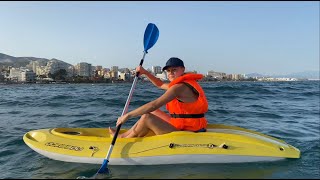 IviRoses Kayaking at the Beach waring a Lifejacket